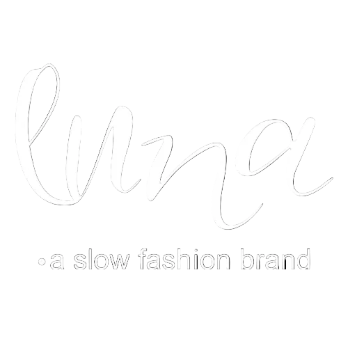 White script logo reading 'luna' with smaller text '• a slow fashion brand' centered on a solid black background.