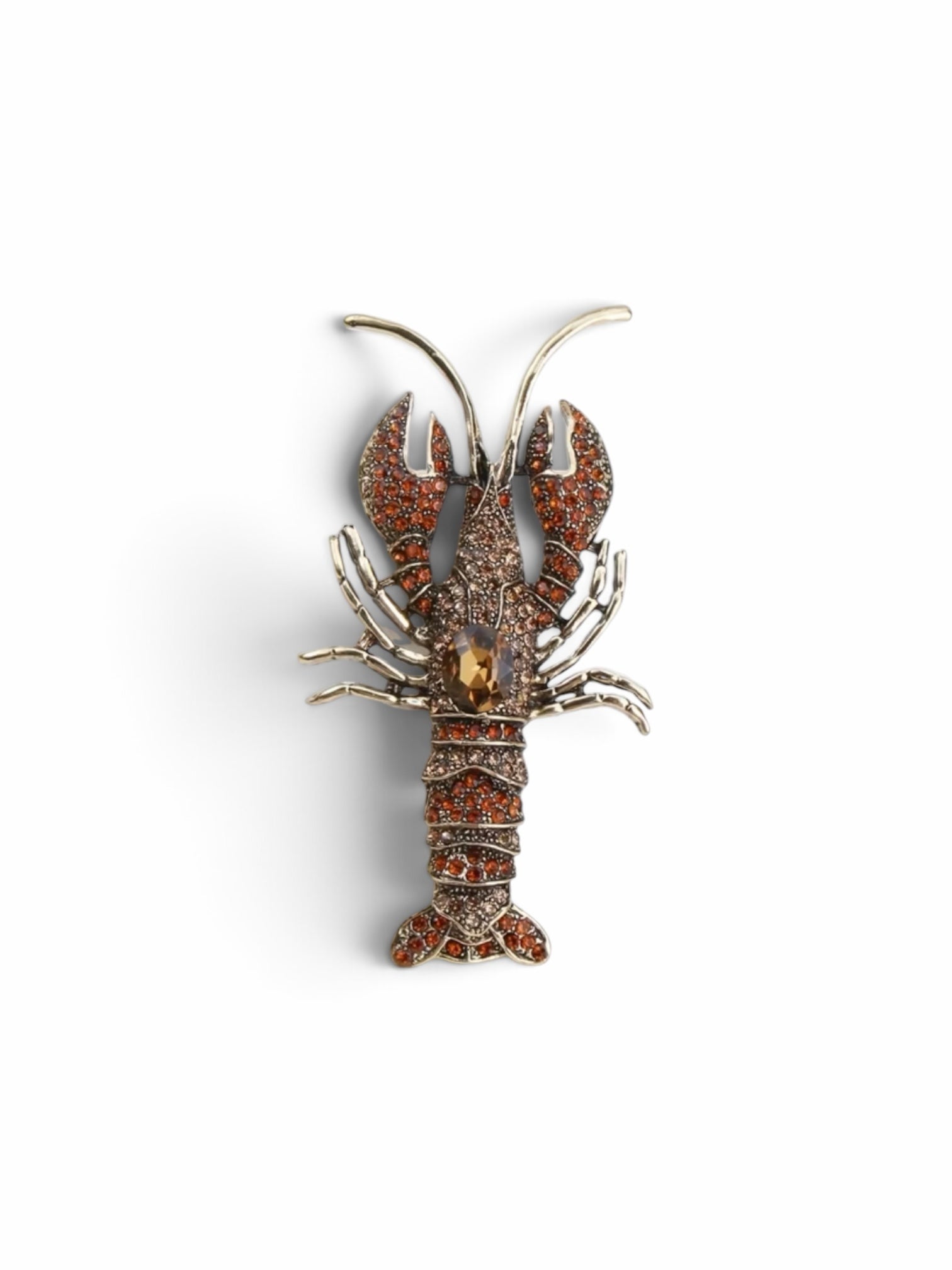 Luna Cotton amber crystal lobster lapel pin brooch with a central faceted stone and intricate metalwork detail.