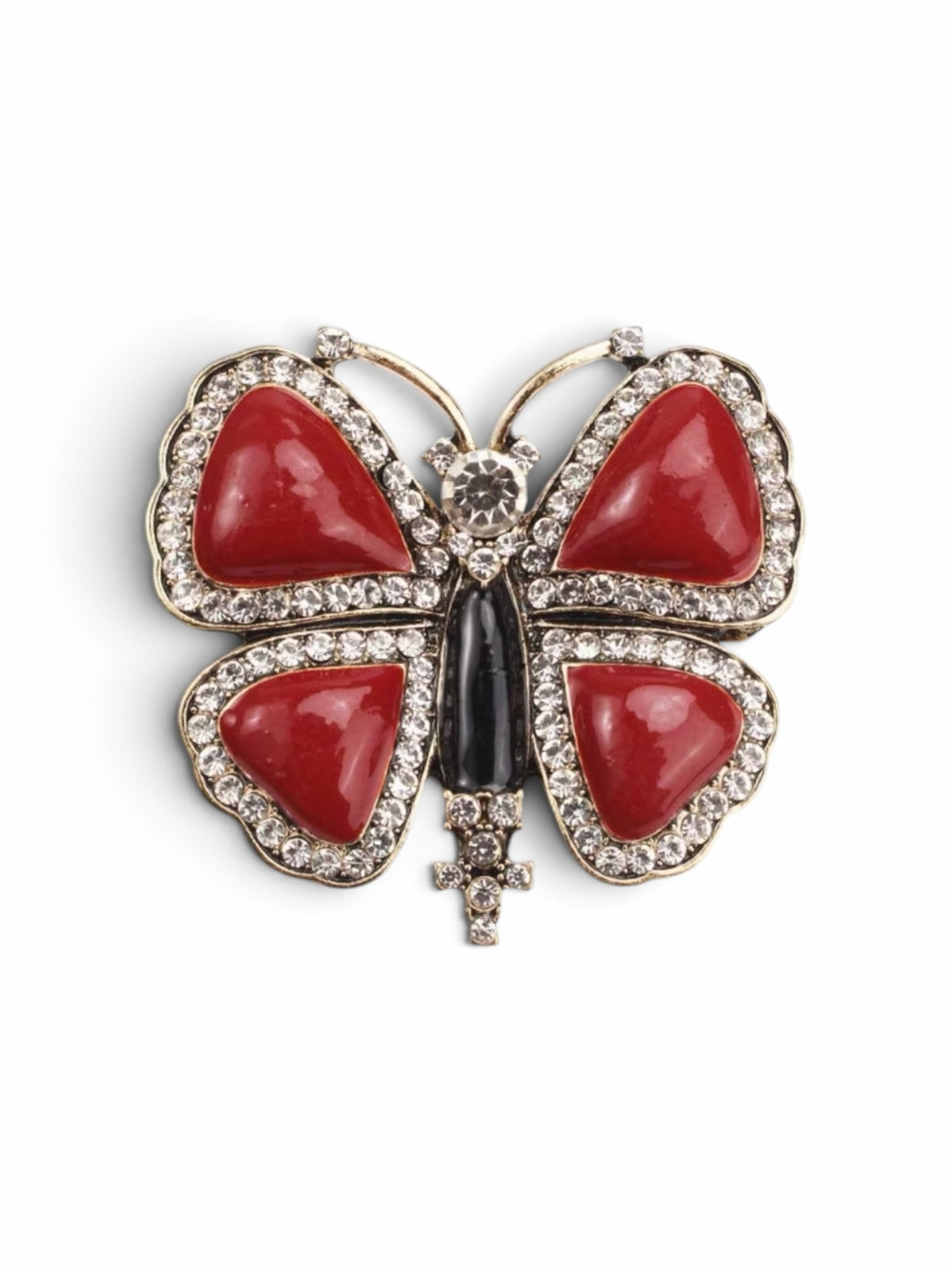 Luna Cotton butterfly lapel pin featuring vibrant red stone inlays, crystal accents, and a sleek black central body.