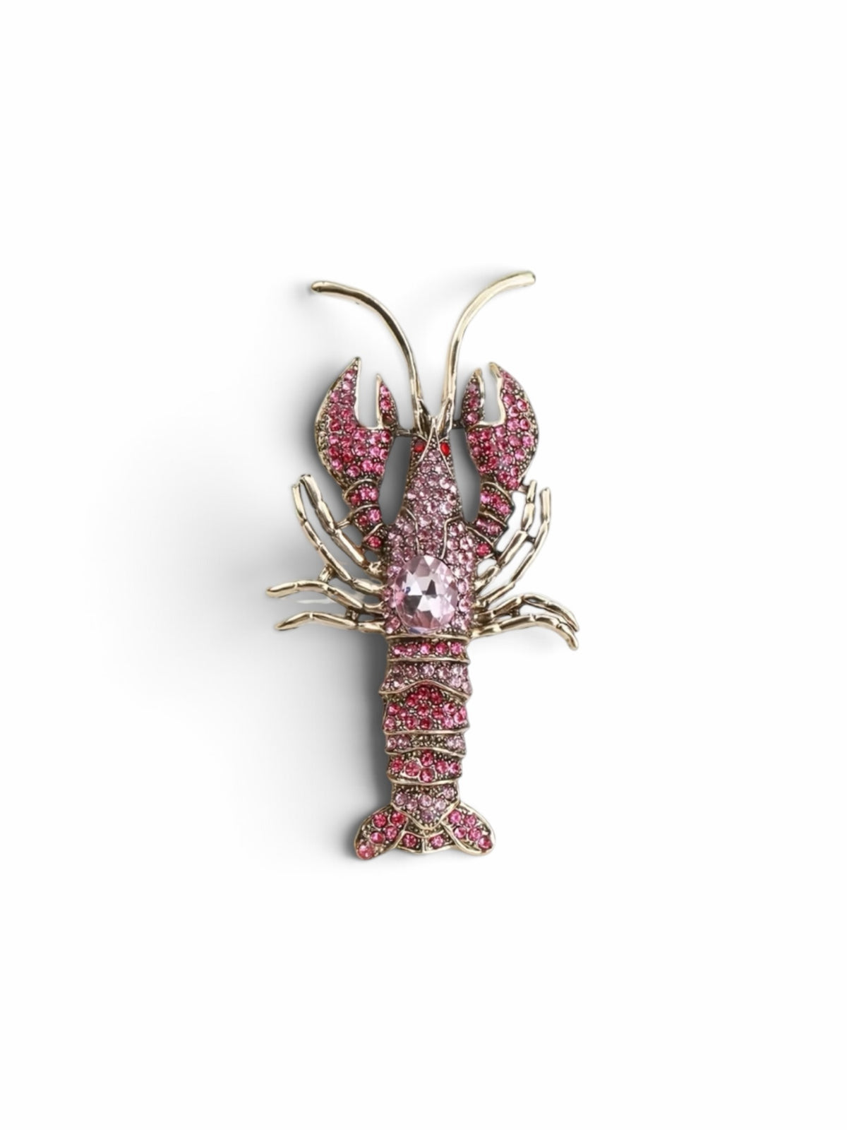 Luna Cotton lobster-shaped lapel pin brooch adorned with sparkling pink crystals and a central faceted stone.
