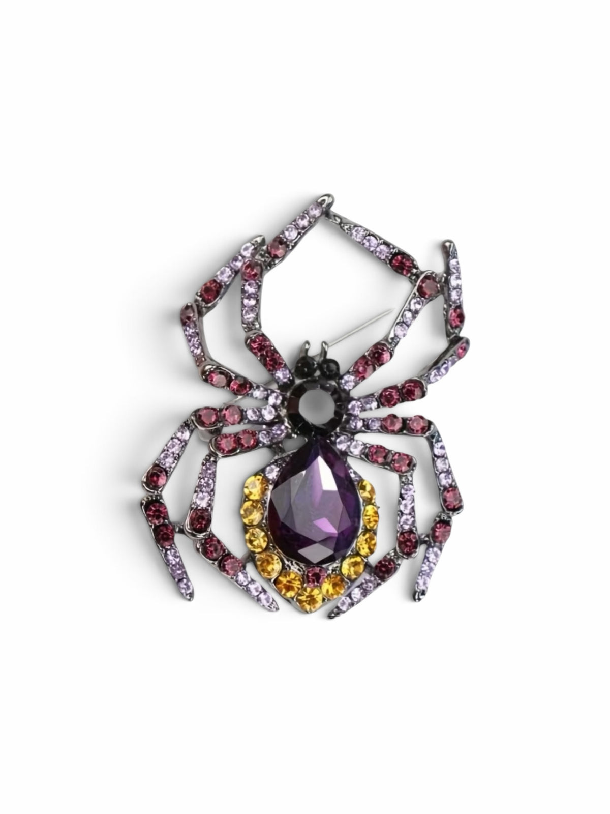 Luna Cotton spider brooch featuring a purple teardrop crystal, yellow stones, and pink and violet crystal-set legs.